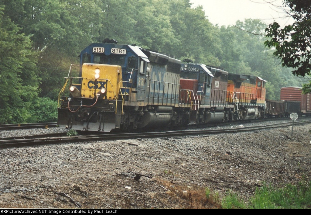 Eastbound manifest departs on a gloomy afternoon